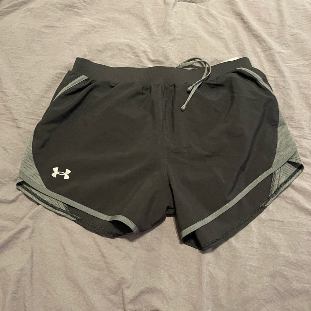 Two pairs size medium Under Armour shorts with lining inside.